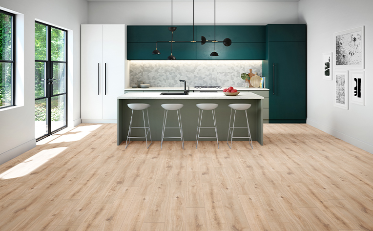 kitchen with wood look flooring and a white patterned backsplash